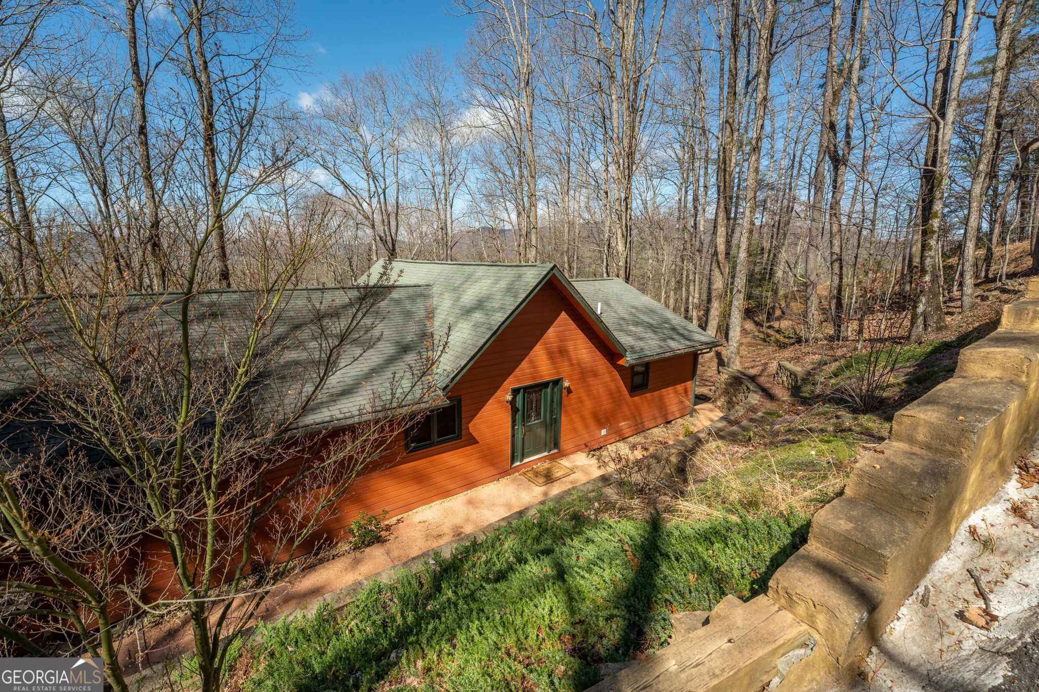 44 Juniper Trail Clayton, GA 30525 - Photo 41 of 87 a backyard of a house with large trees and outdoor seating
