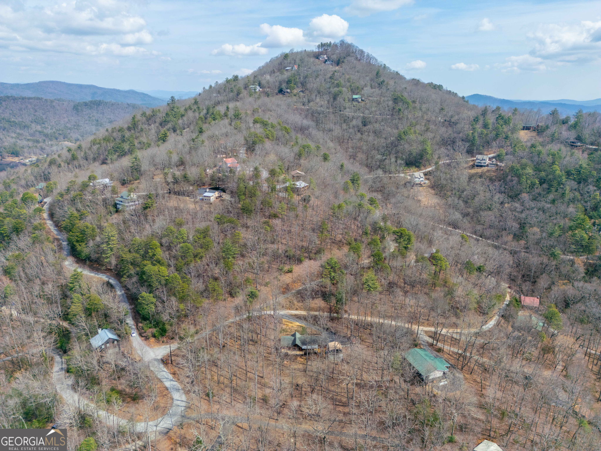 44 Juniper Trail Clayton, GA 30525 - Photo 83 of 87 a view of a dry field with trees in the background