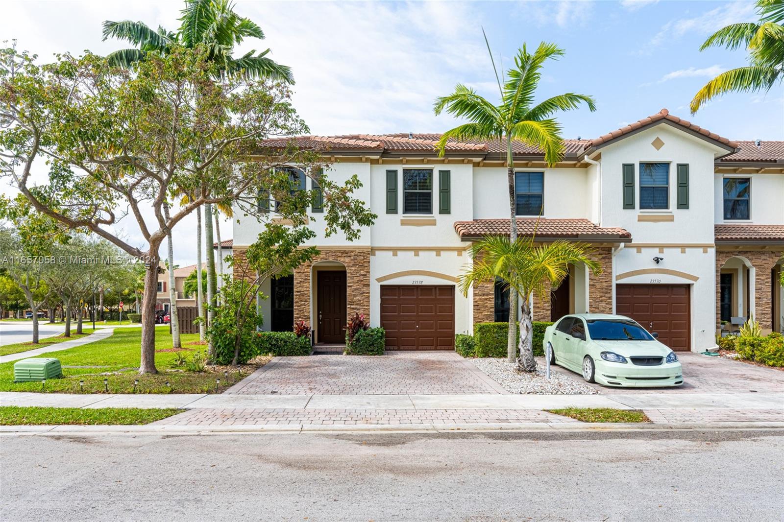 23578 Southwest 113th Path Homestead, FL 33032 - Photo 1 of 59 a front view of a house with a garden and plants