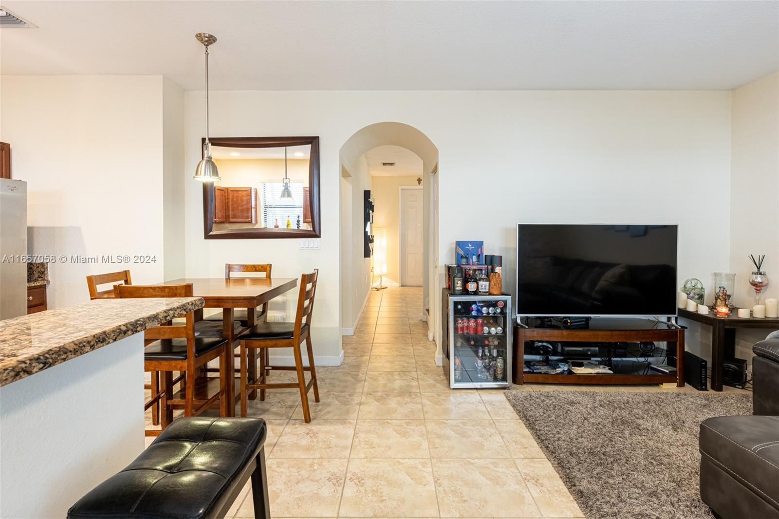 23578 Southwest 113th Path Homestead, FL 33032 - Photo 12 of 59 a living room with furniture and a flat screen tv
