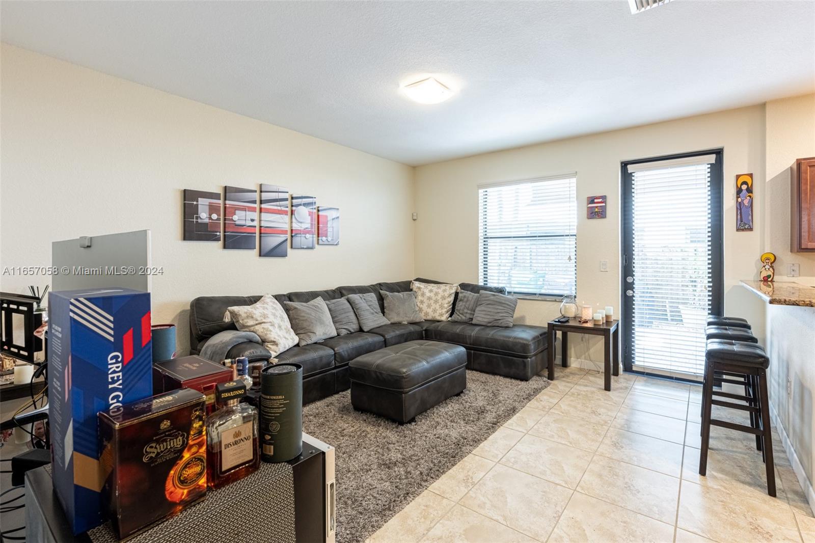 23578 Southwest 113th Path Homestead, FL 33032 - Photo 15 of 59 a living room with furniture a flat screen tv and a window