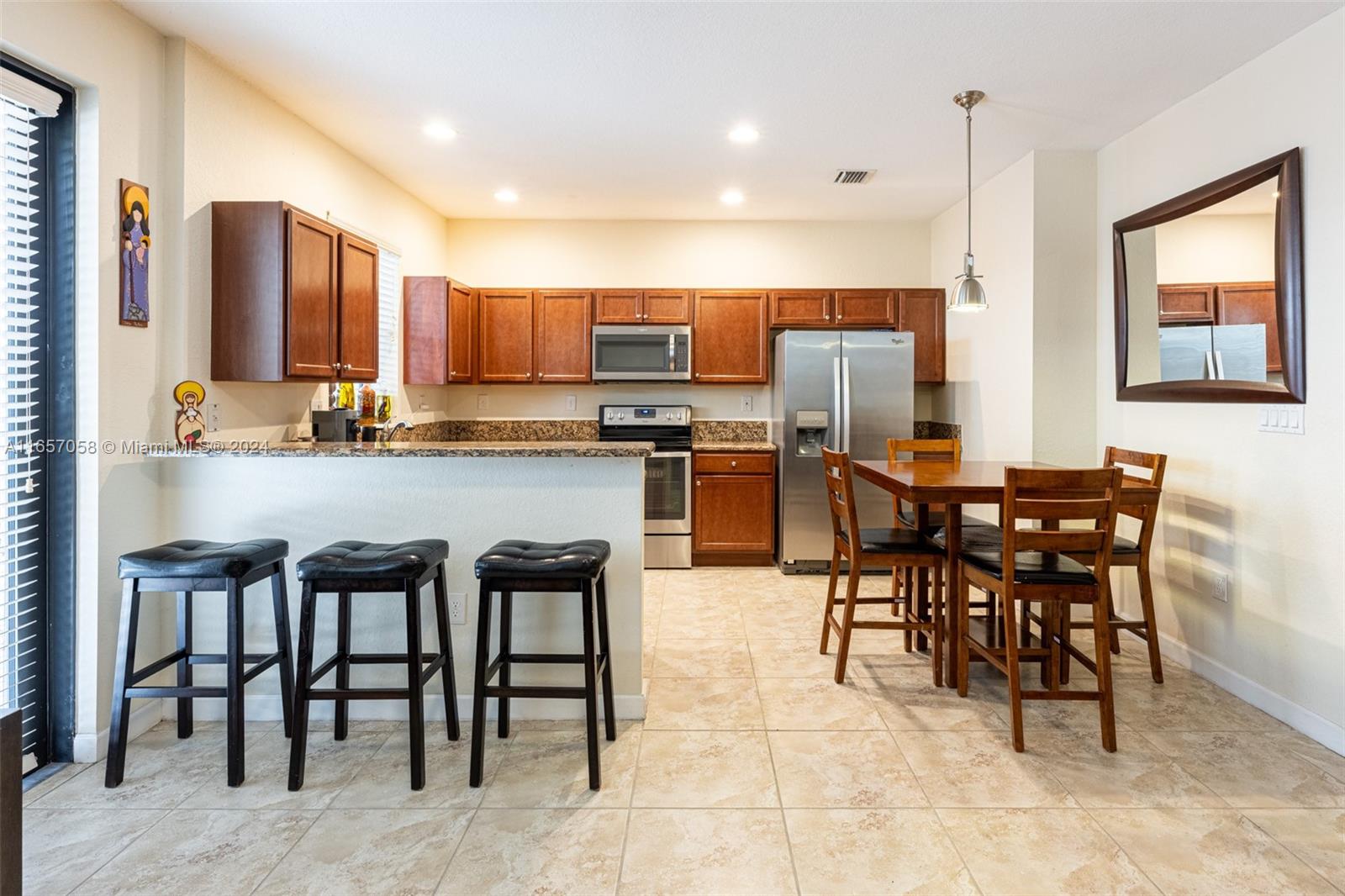 23578 Southwest 113th Path Homestead, FL 33032 - Photo 19 of 59 a view of a dining room kitchen counter top space and appliances