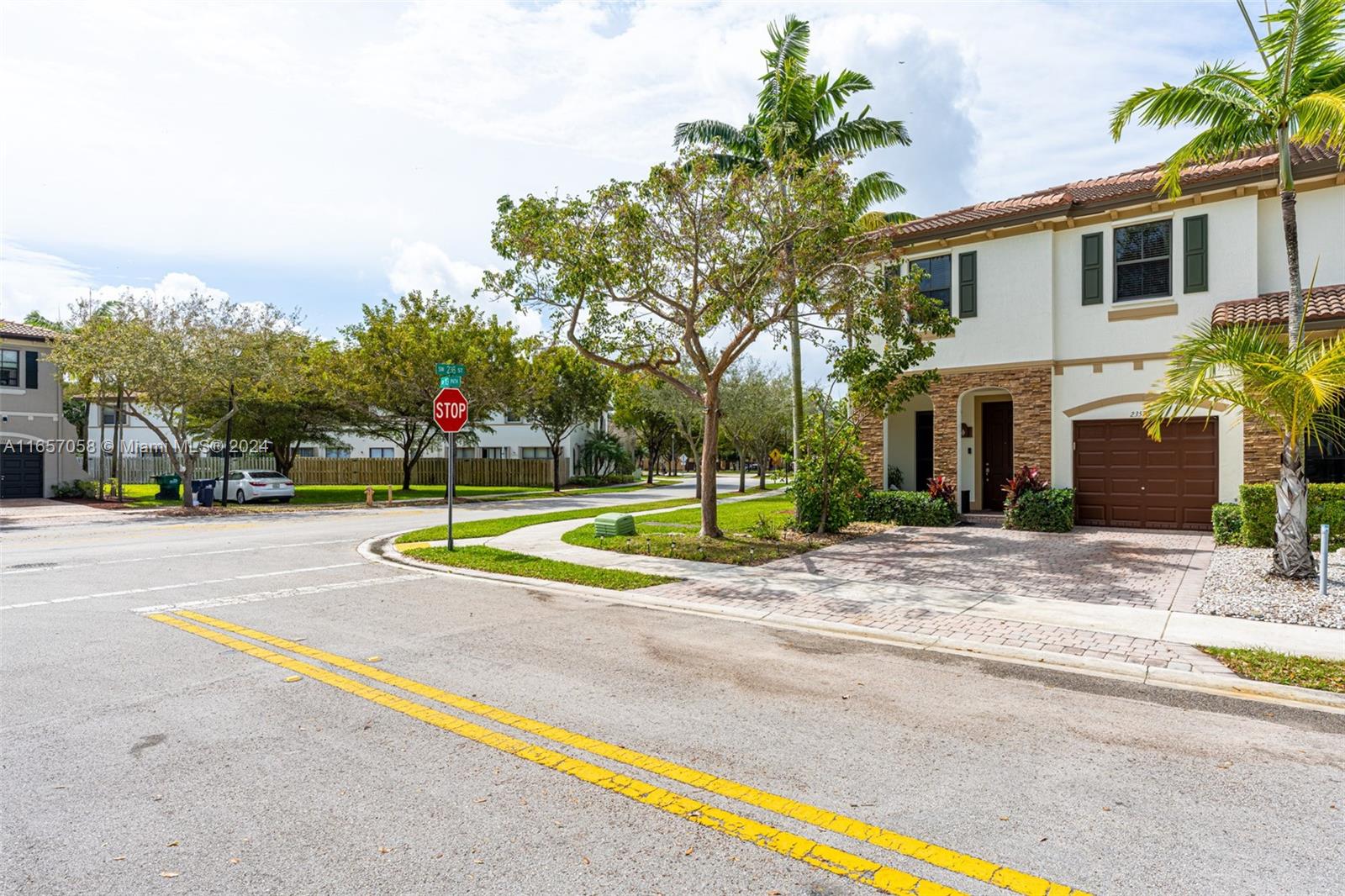23578 Southwest 113th Path Homestead, FL 33032 - Photo 2 of 59 a view of a house with a swimming pool and a large tree