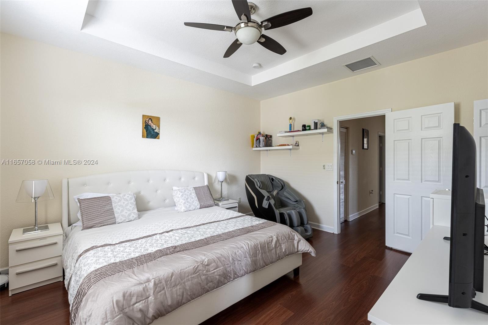 23578 Southwest 113th Path Homestead, FL 33032 - Photo 23 of 59 a bedroom with a bed and wooden floor