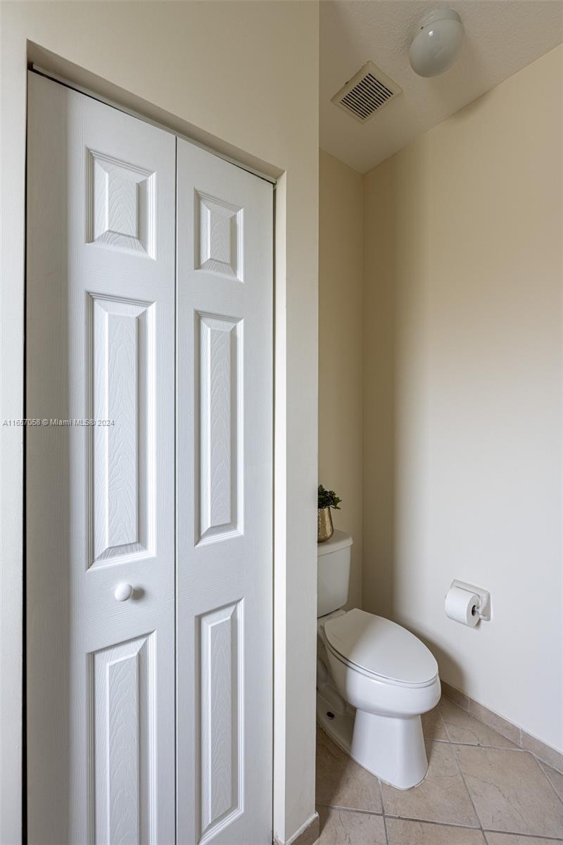 23578 Southwest 113th Path Homestead, FL 33032 - Photo 28 of 59 a white toilet sitting next to a bathroom sink