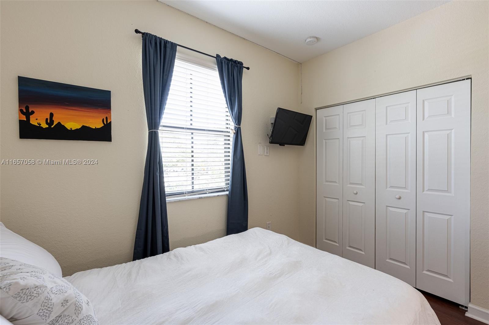 23578 Southwest 113th Path Homestead, FL 33032 - Photo 31 of 59 a bedroom with a bed and a flat screen tv