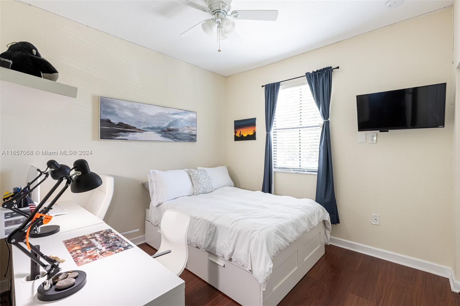 23578 Southwest 113th Path Homestead, FL 33032 - Photo 32 of 59 a bedroom with a bed and a flat screen tv