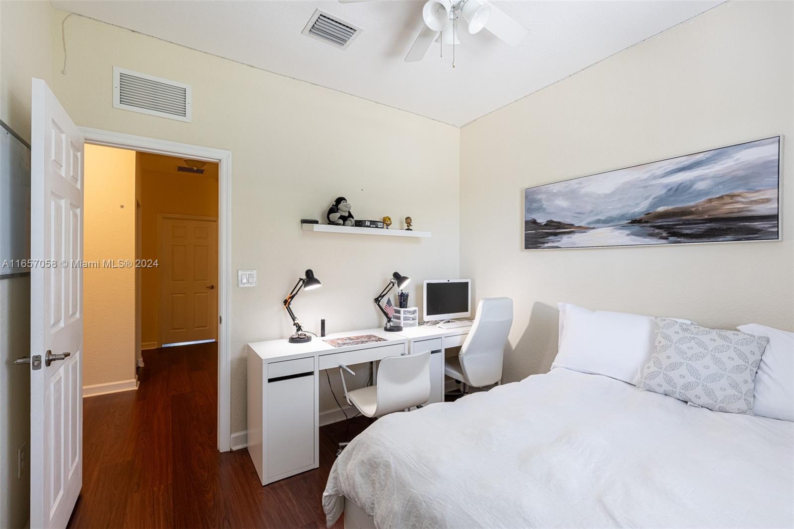 23578 Southwest 113th Path Homestead, FL 33032 - Photo 33 of 59 a bedroom with a bed and a chandelier