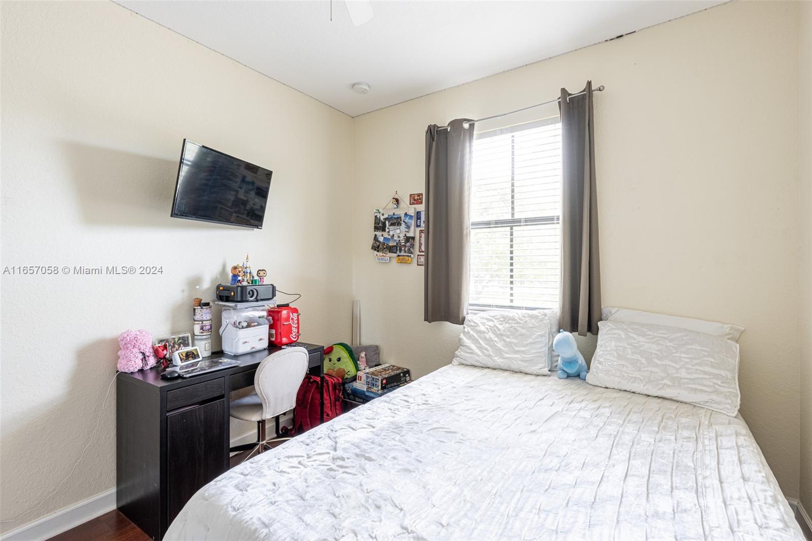 23578 Southwest 113th Path Homestead, FL 33032 - Photo 38 of 59 a bedroom with a bed and a window