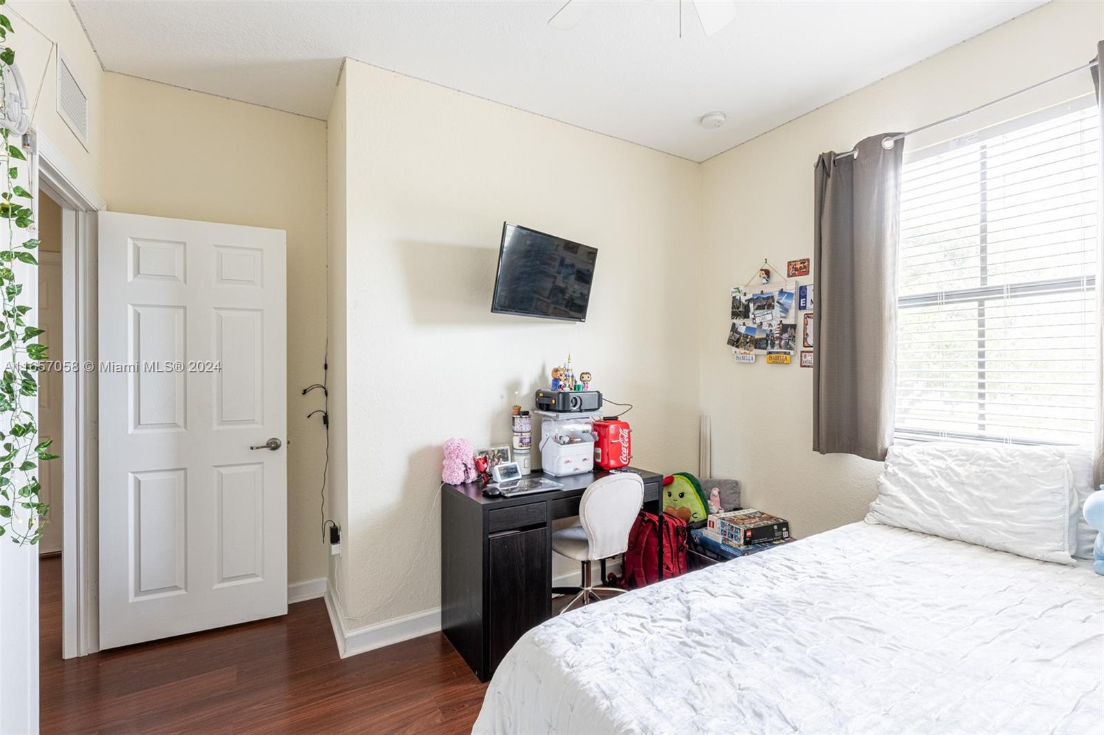 23578 Southwest 113th Path Homestead, FL 33032 - Photo 39 of 59 a bedroom with a bed and a window