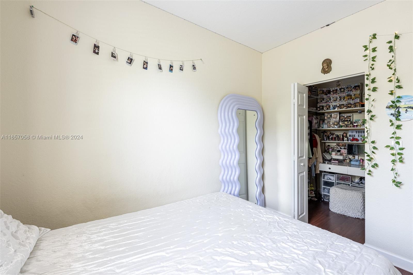 23578 Southwest 113th Path Homestead, FL 33032 - Photo 40 of 59 a bedroom with a bed and a refrigerator