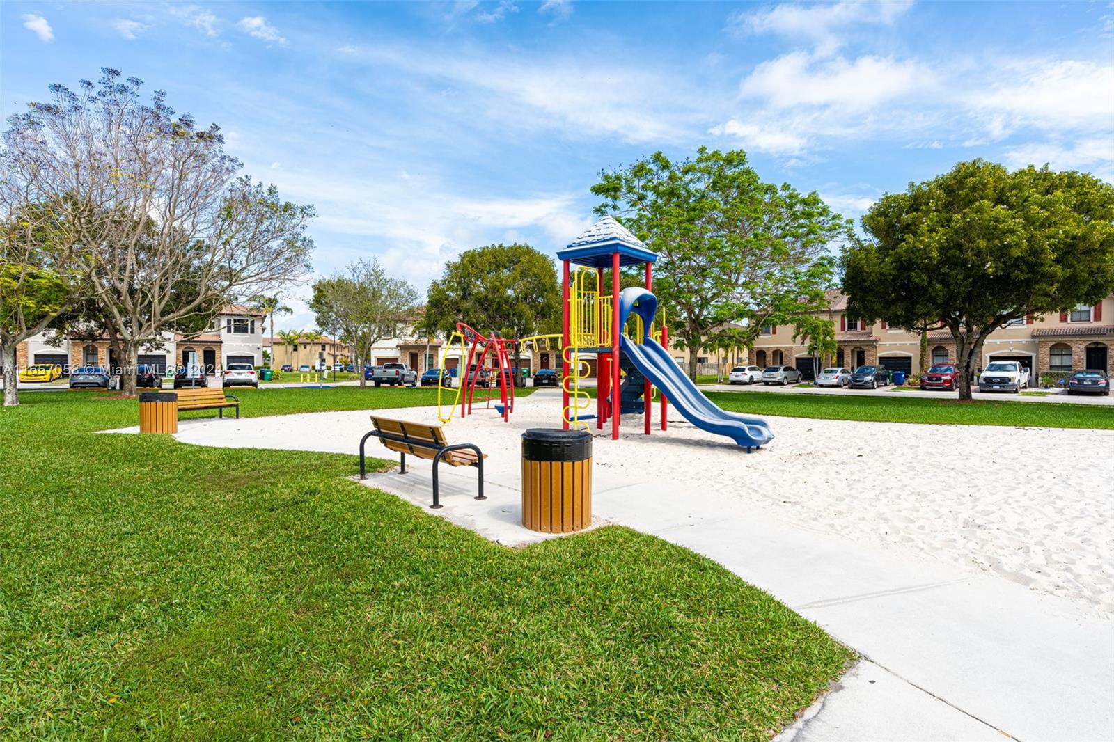 23578 Southwest 113th Path Homestead, FL 33032 - Photo 51 of 59 a park with lots of swings and slides