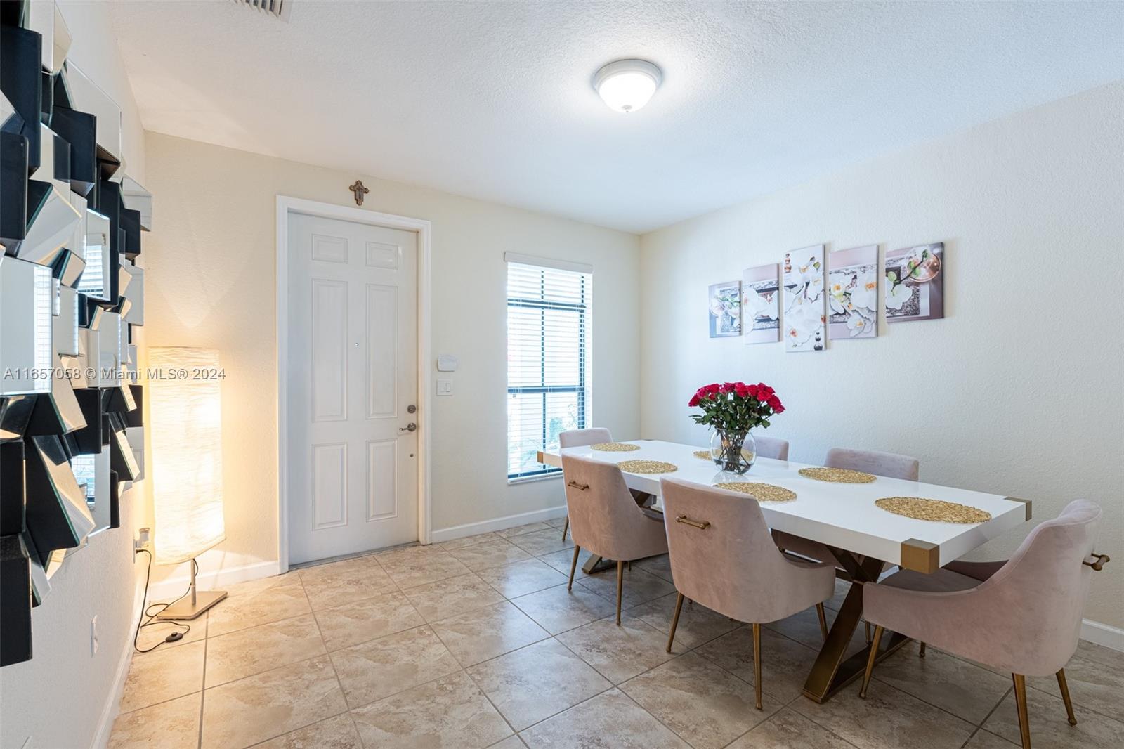 23578 Southwest 113th Path Homestead, FL 33032 - Photo 9 of 59 a view of a dining room with furniture and a chandelier