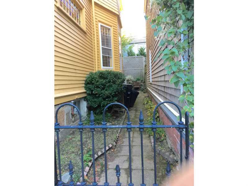 108 Spring Street Newport, RI 02840 - Photo 21 of 22 Yard/Garden. IRON GATE LEADING TO GARDEN AND REAR ENRTANCE.