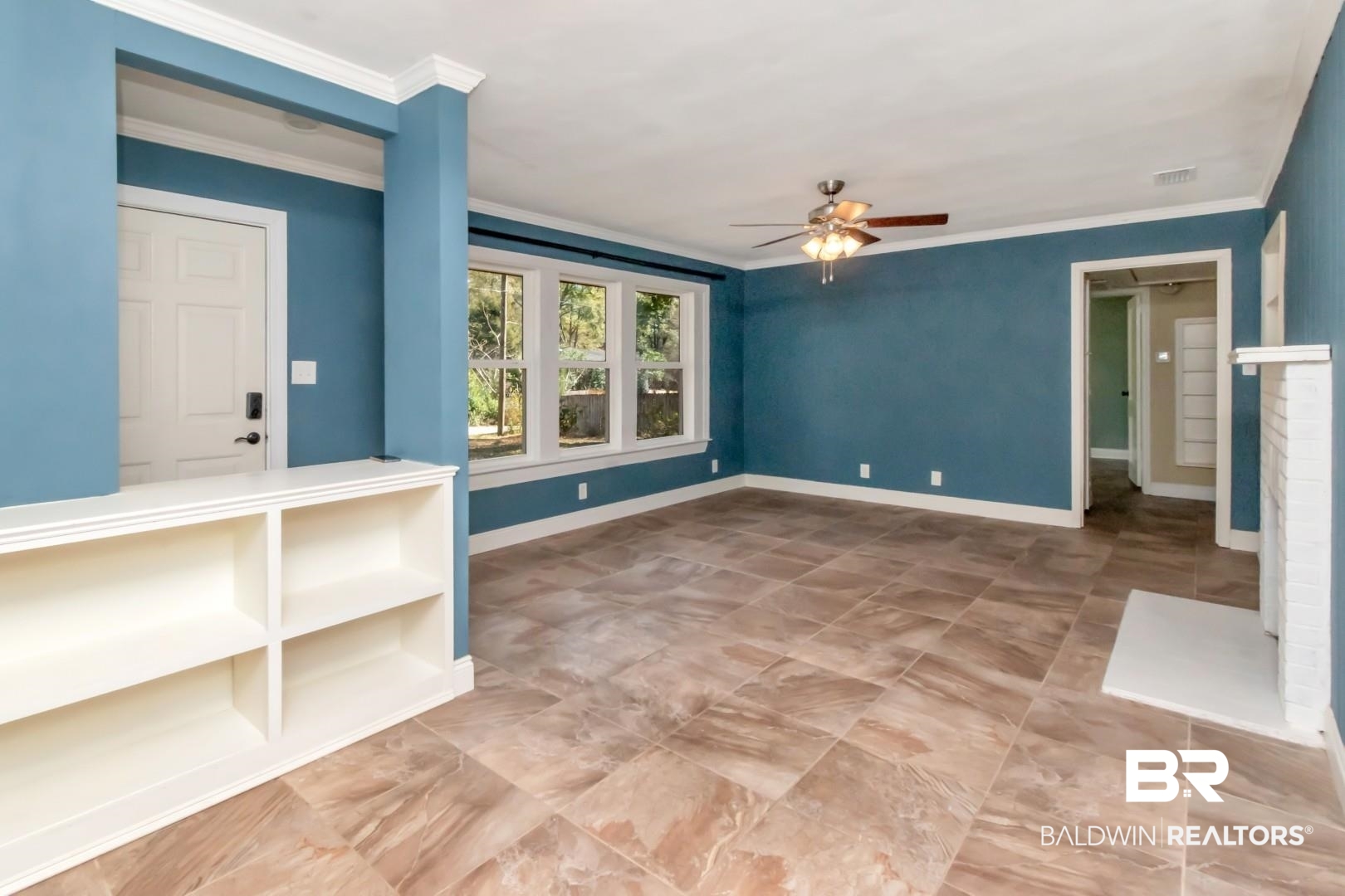 410 St John Place Mobile, AL 36609 - Photo 8 of 32 Empty room with a ceiling fan and ornamental molding