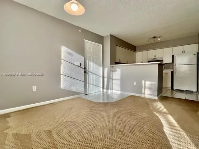 a view of a kitchen with a sink