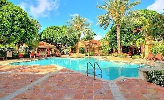 a house with swimming pool in front of it