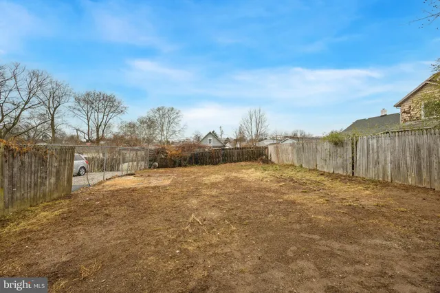 a view of a backyard of the house