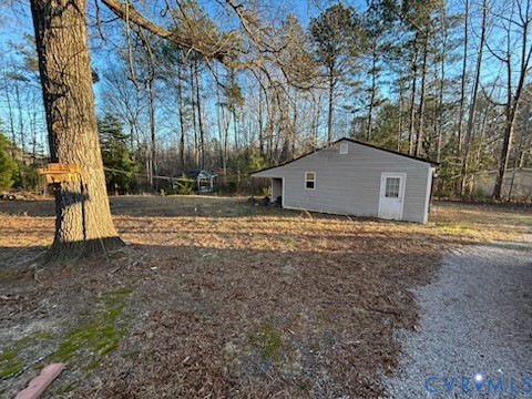 10209 Colemans Lake Road Ford, VA 23850 - Photo 4 of 6 View of yard featuring view of wooded area