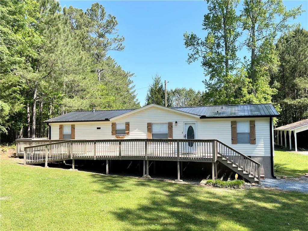 159 Flat Woods Road Calhoun, GA 30701 - Photo 1 of 1 a view of a house with swimming pool and sitting area