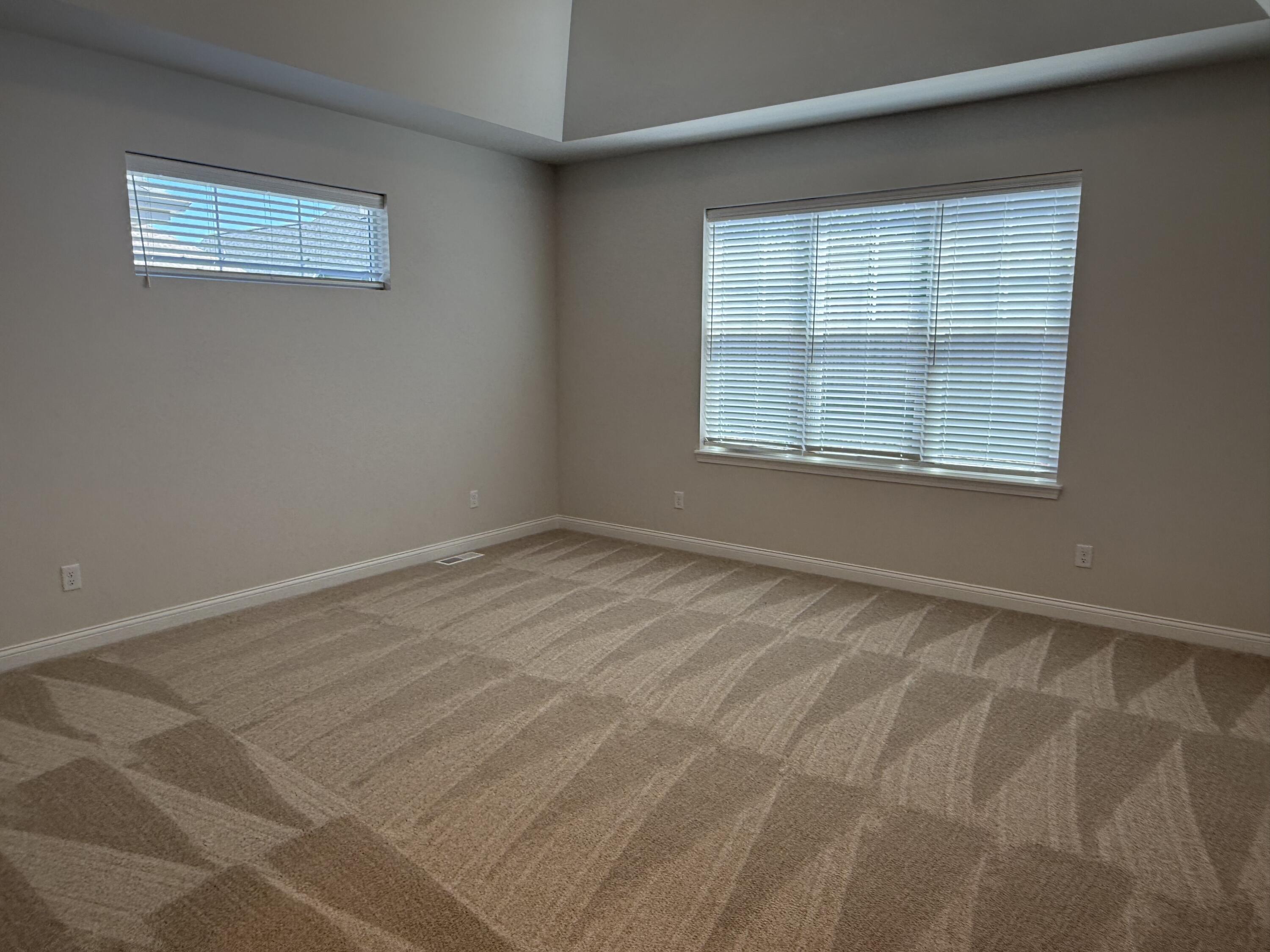 369 Evergreen Lane Pewaukee, WI 53072 - Photo 9 of 27 Spacious Primary Bedroom w/Tray Ceiling
