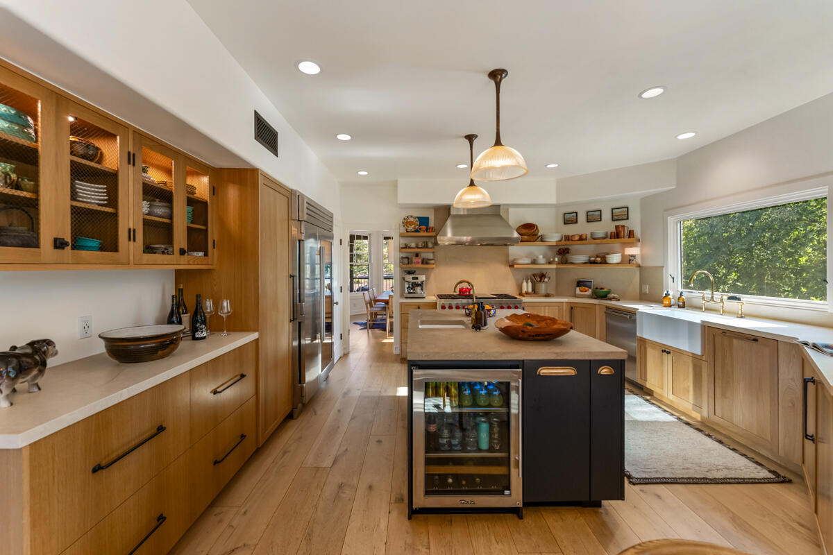 13100 Ojai Road Santa Paula, CA 93060 - Photo 18 of 60 a kitchen with stainless steel appliances granite countertop a stove a sink a refrigerator and a wooden cabinets