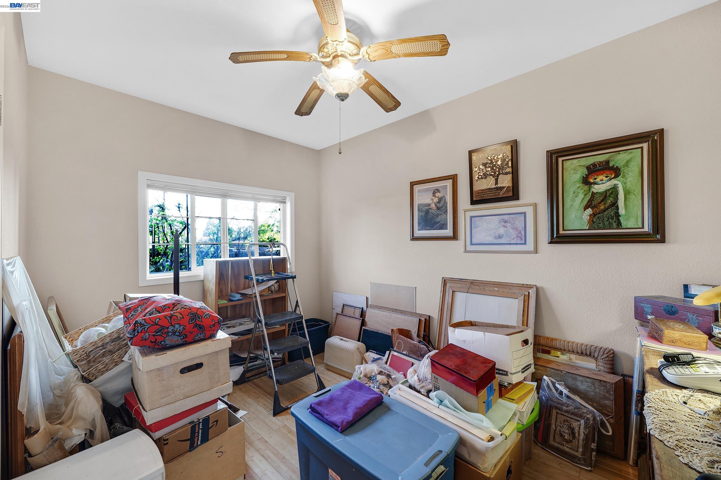 1177 Thiel Road Hayward, CA 94544 - Photo 13 of 55 a bedroom with furniture and a window