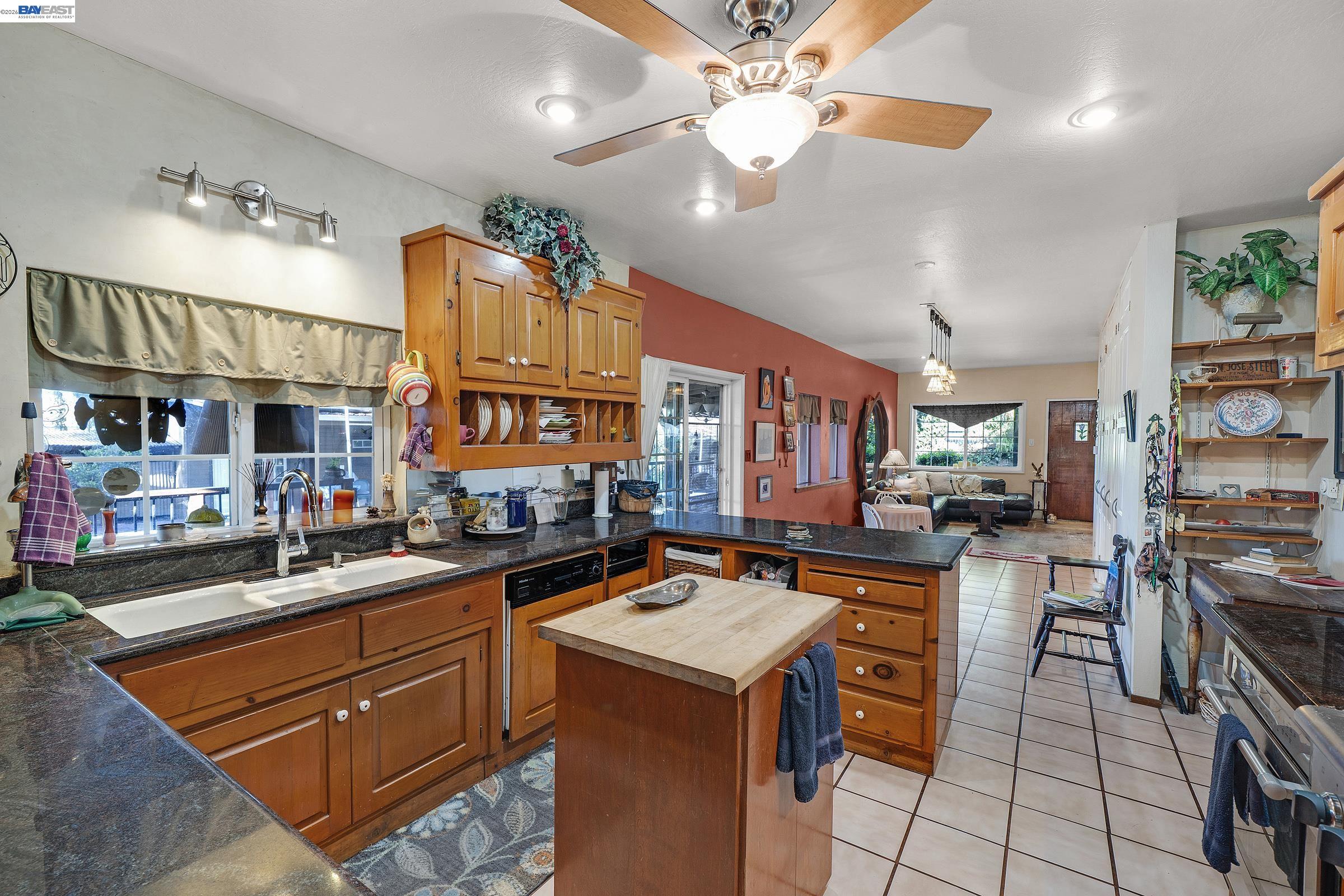 1177 Thiel Road Hayward, CA 94544 - Photo 14 of 55 a open kitchen with stainless steel appliances granite countertop a sink stove and refrigerator