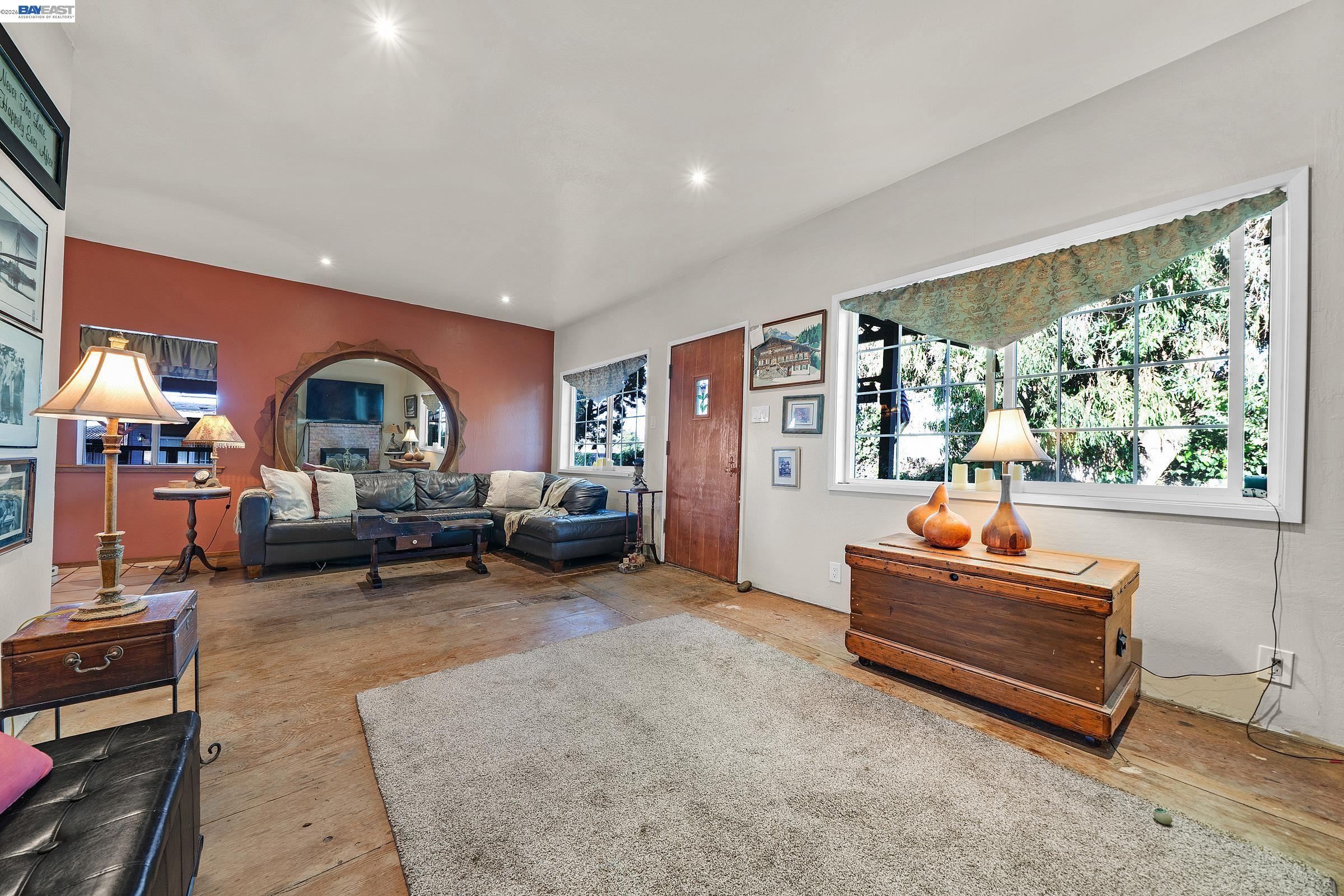 1177 Thiel Road Hayward, CA 94544 - Photo 25 of 55 a living room with furniture and a piano