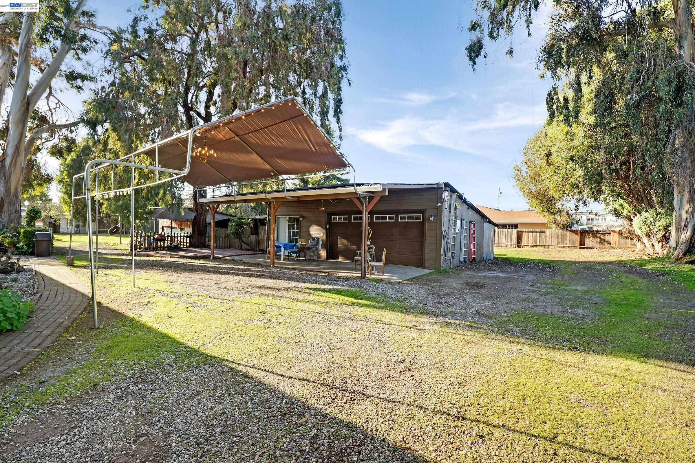 1177 Thiel Road Hayward, CA 94544 - Photo 30 of 55 a view of a house with pool and a yard