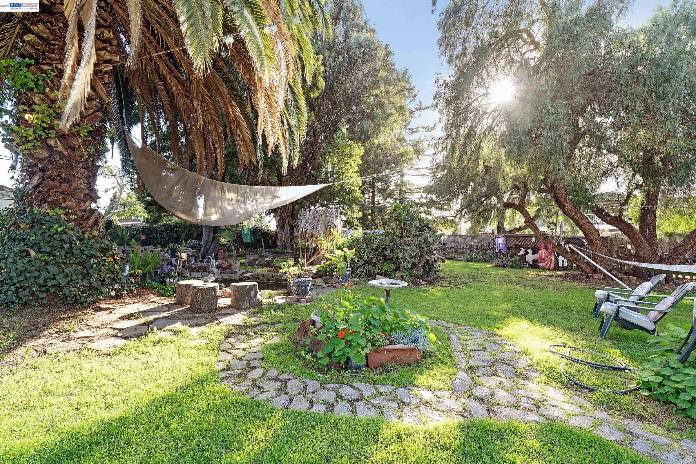 1177 Thiel Road Hayward, CA 94544 - Photo 51 of 55 a backyard of a house with table and chairs