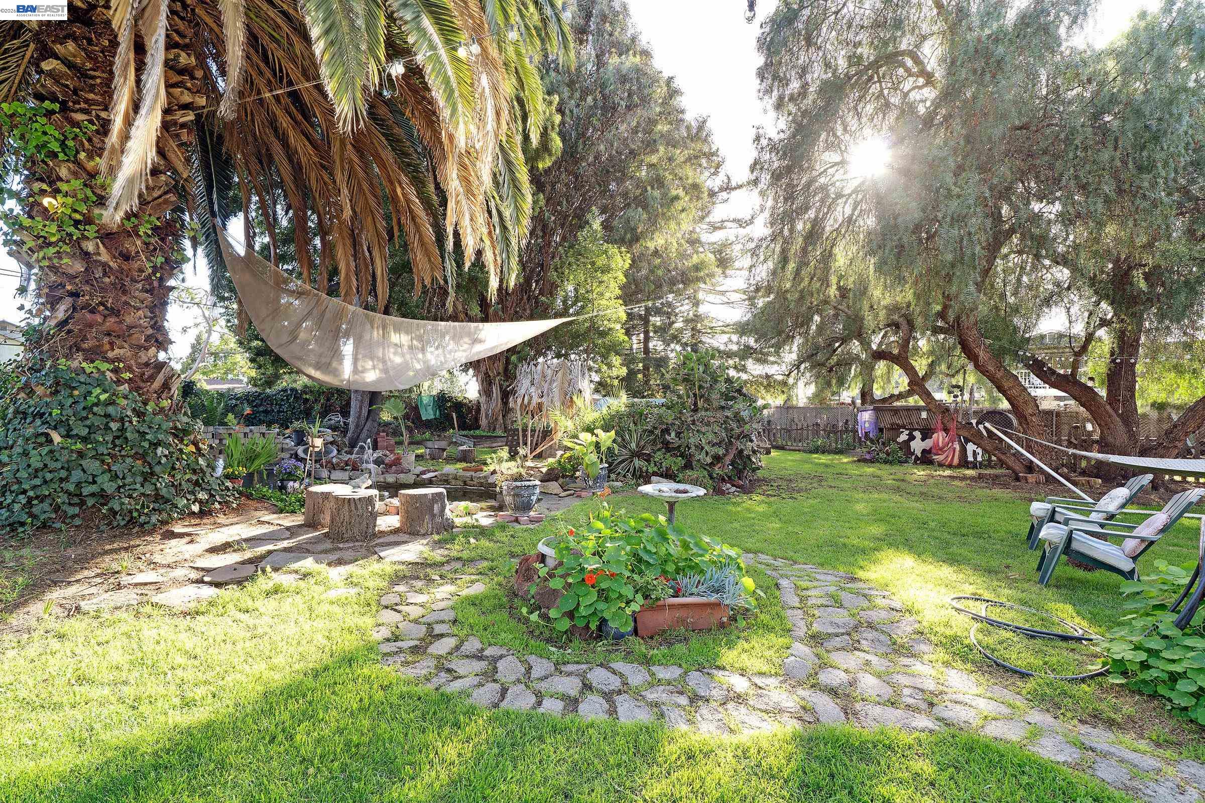 1177 Thiel Road Hayward, CA 94544 - Photo 52 of 55 a backyard of a house with table and chairs