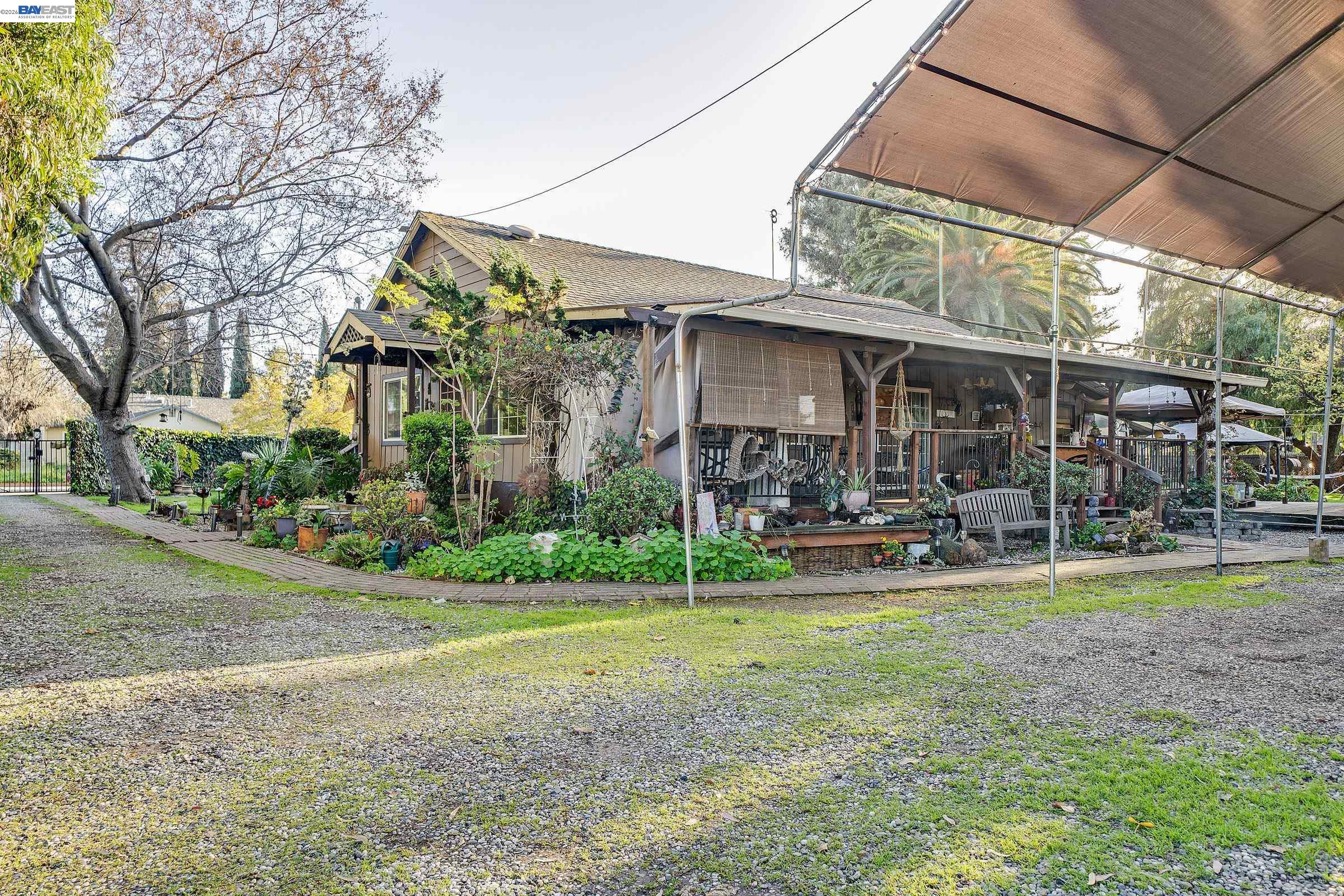 1177 Thiel Road Hayward, CA 94544 - Photo 55 of 55 a view of a chair and table in backyard of the house