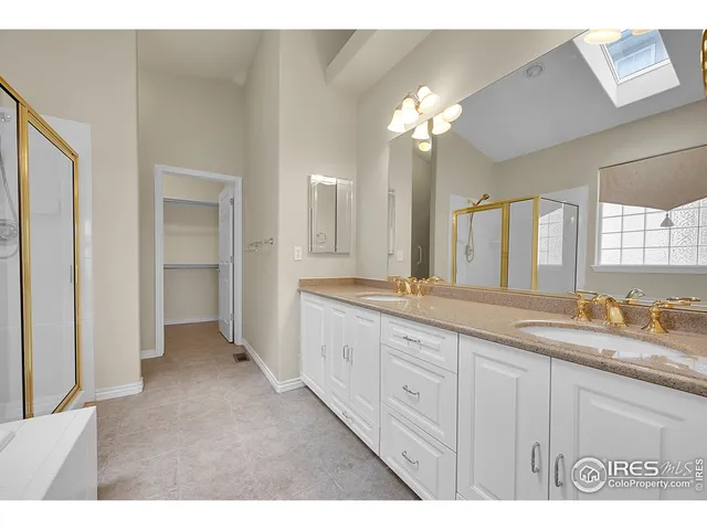 a bathroom with a granite countertop sink a toilet and a mirror