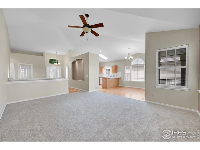 a view of wooden floor and a cabinet in a room