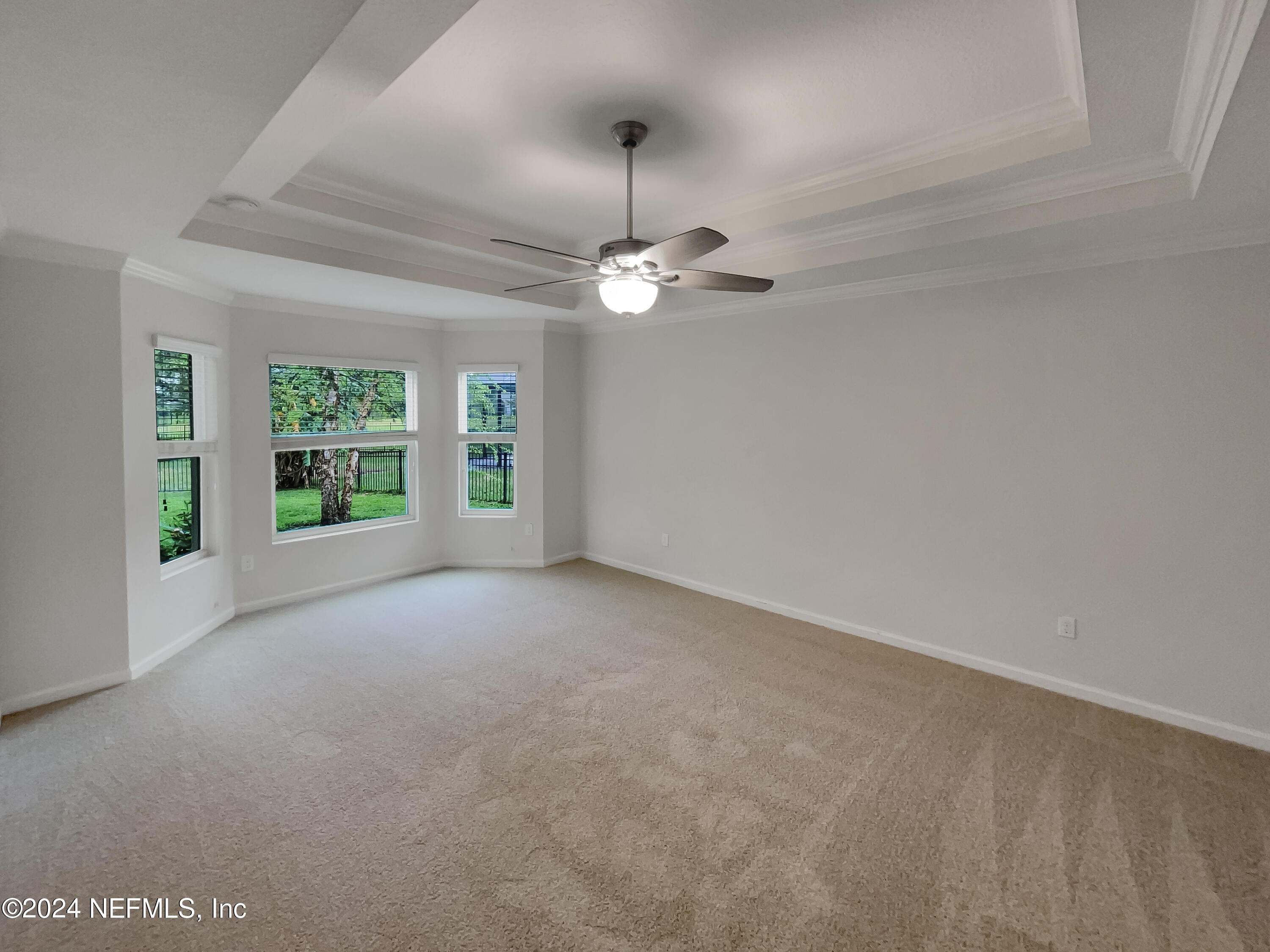 204 Providence Drive St. Augustine, FL 32092 - Photo 14 of 20 a view of a livingroom with a ceiling fan and window