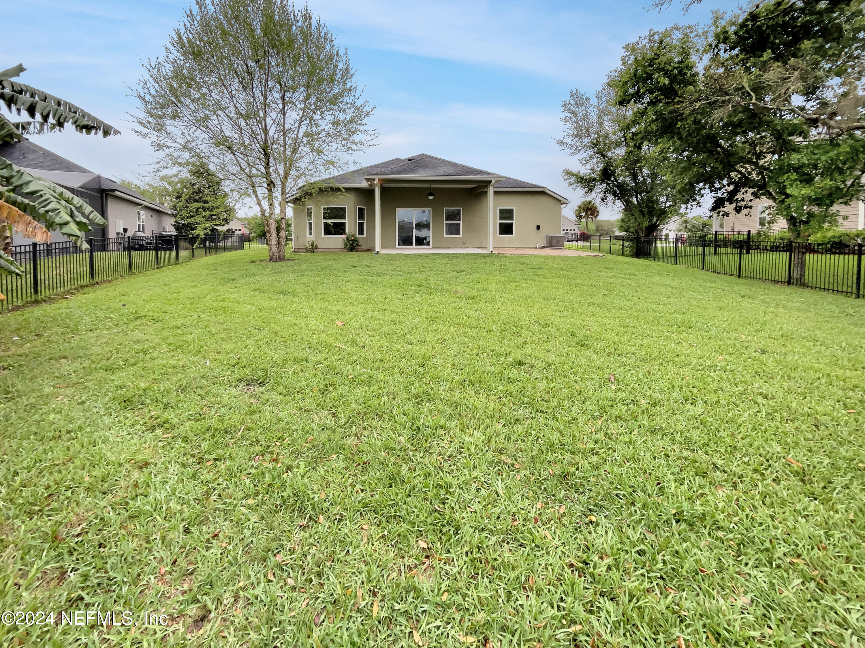 204 Providence Drive St. Augustine, FL 32092 - Photo 19 of 20 a view of a house with a big yard and large trees