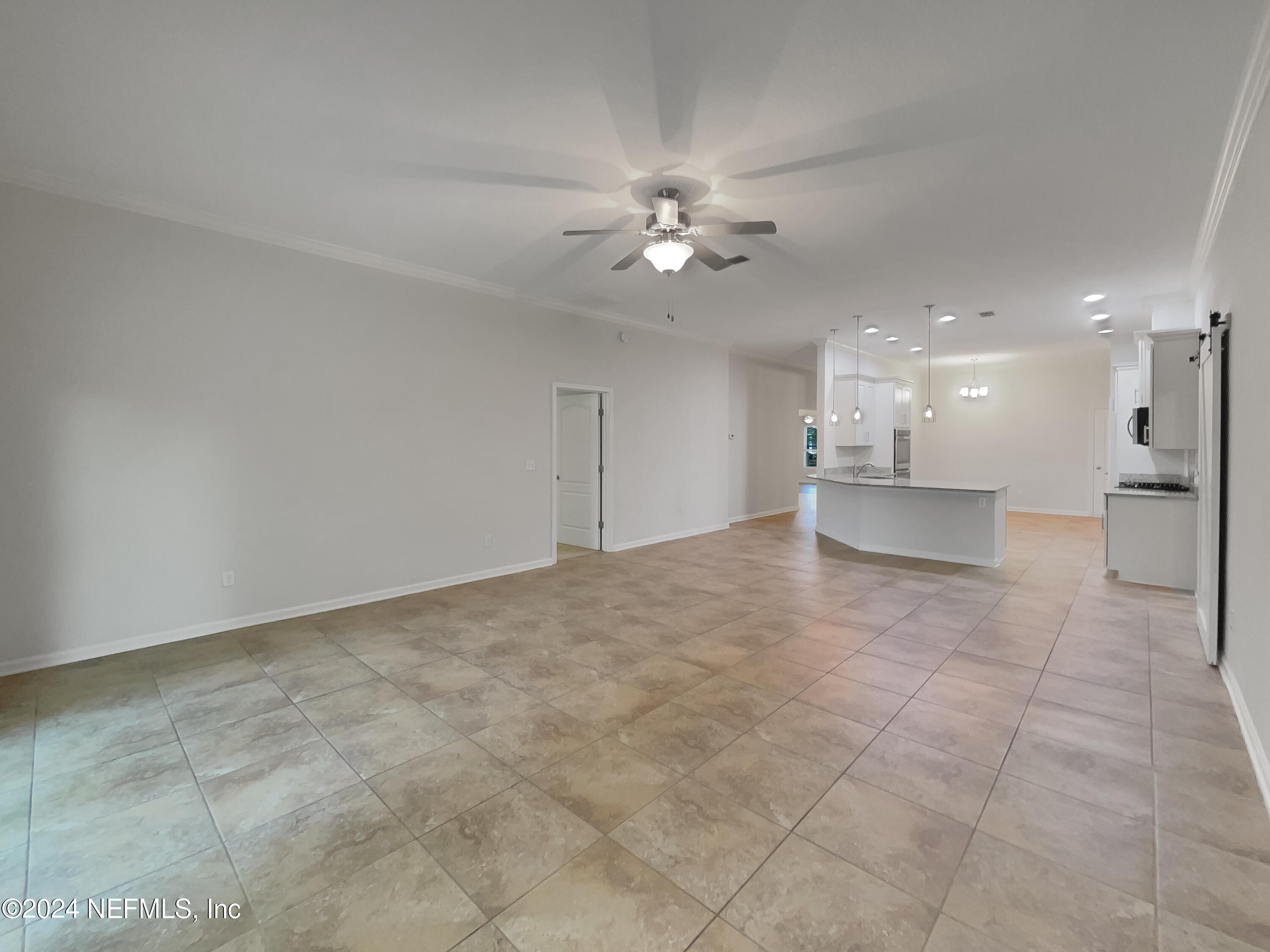 204 Providence Drive St. Augustine, FL 32092 - Photo 10 of 20 a view of a kitchen with a sink and a chandelier fan