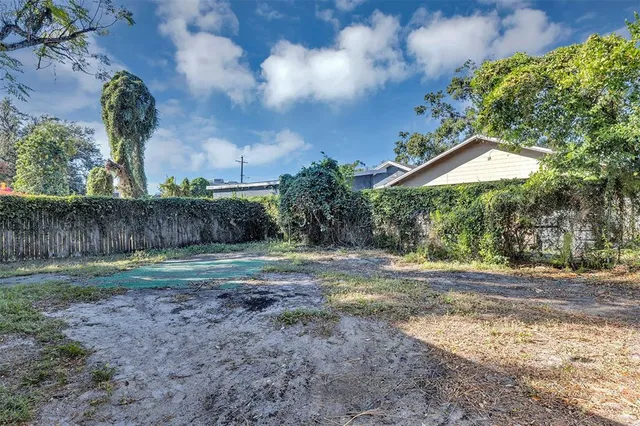 a backyard of a house with lots of green space