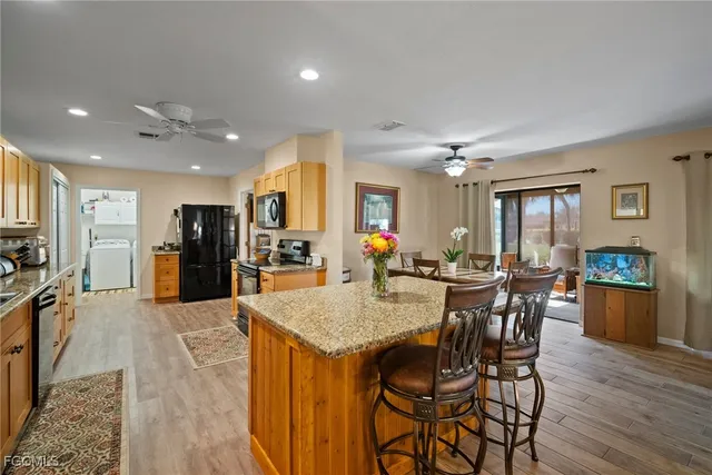 a view of a dining area with furniture and wooden floor