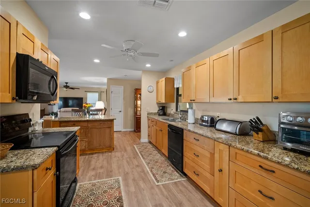 a large kitchen with granite countertop lots of counter top space