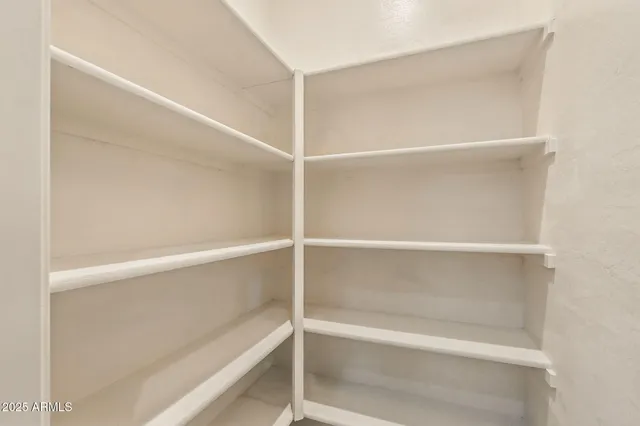 front view of a house with potted plants