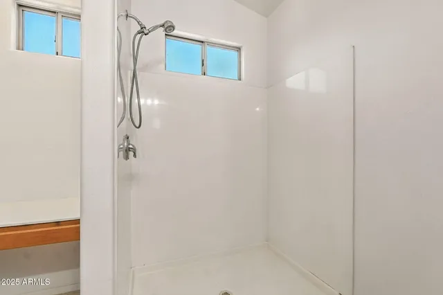 a kitchen with granite countertop cabinets a sink dishwasher and a stove with wooden floor