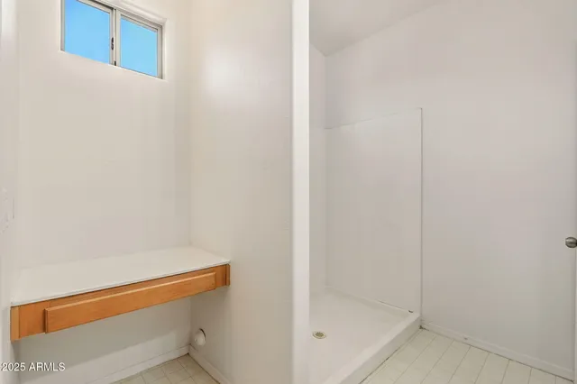 a kitchen with kitchen island granite countertop appliances cabinets and a counter top space