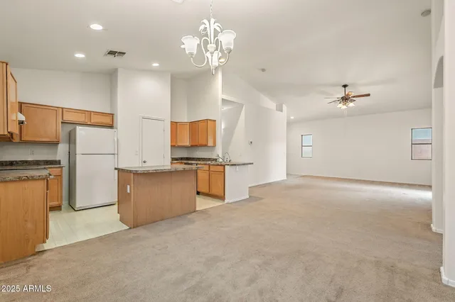 an aerial view of residential houses with city view