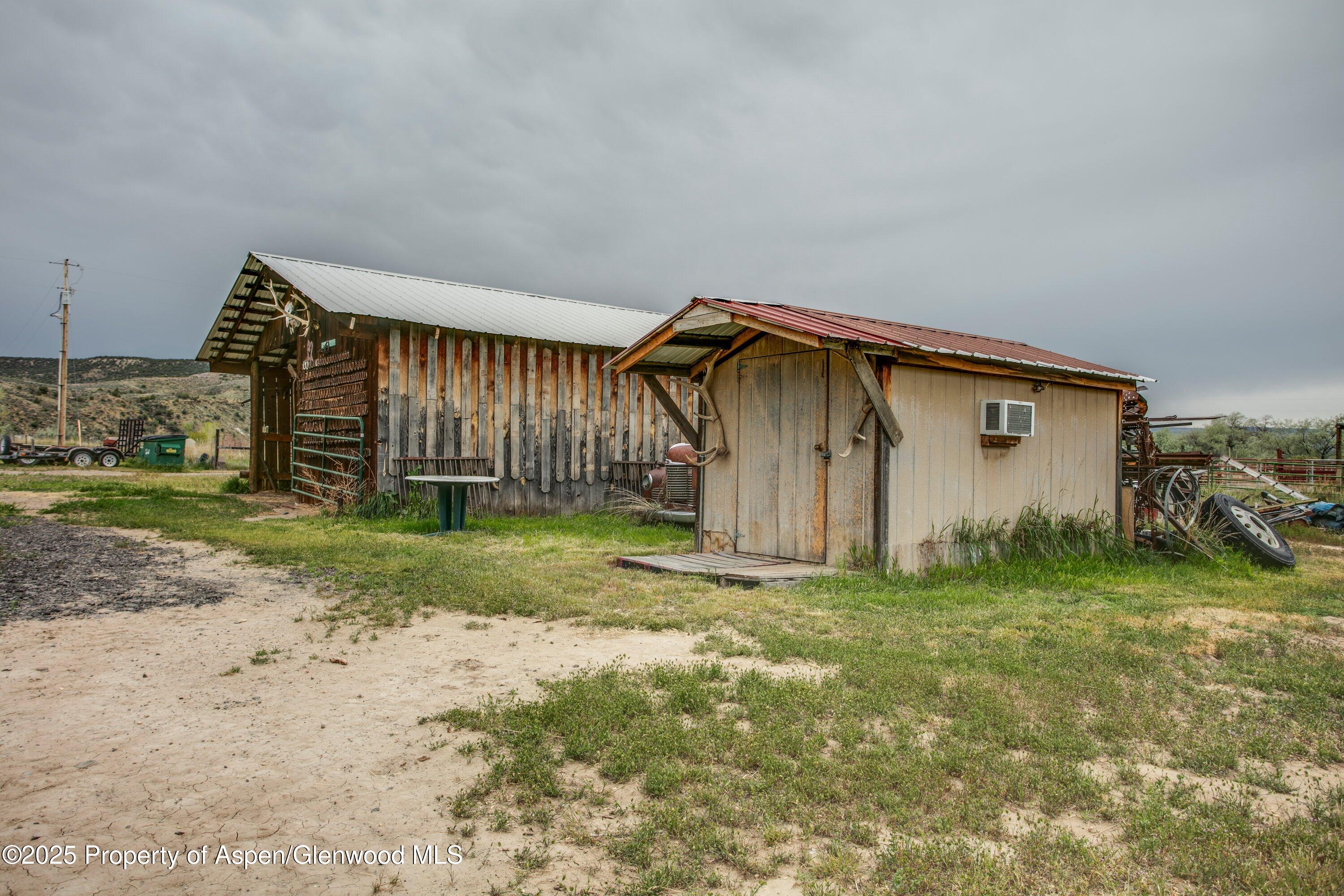 70 Frontage Road De Beque, CO 81630 - Photo 11 of 26 a view of a house with backyard and garden