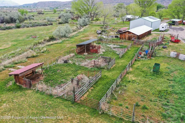 a view of a garden with an outdoor seating