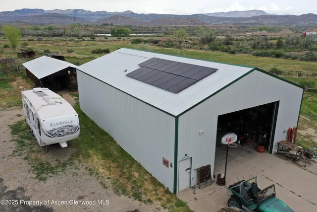 a view of a house with yard and mountain view