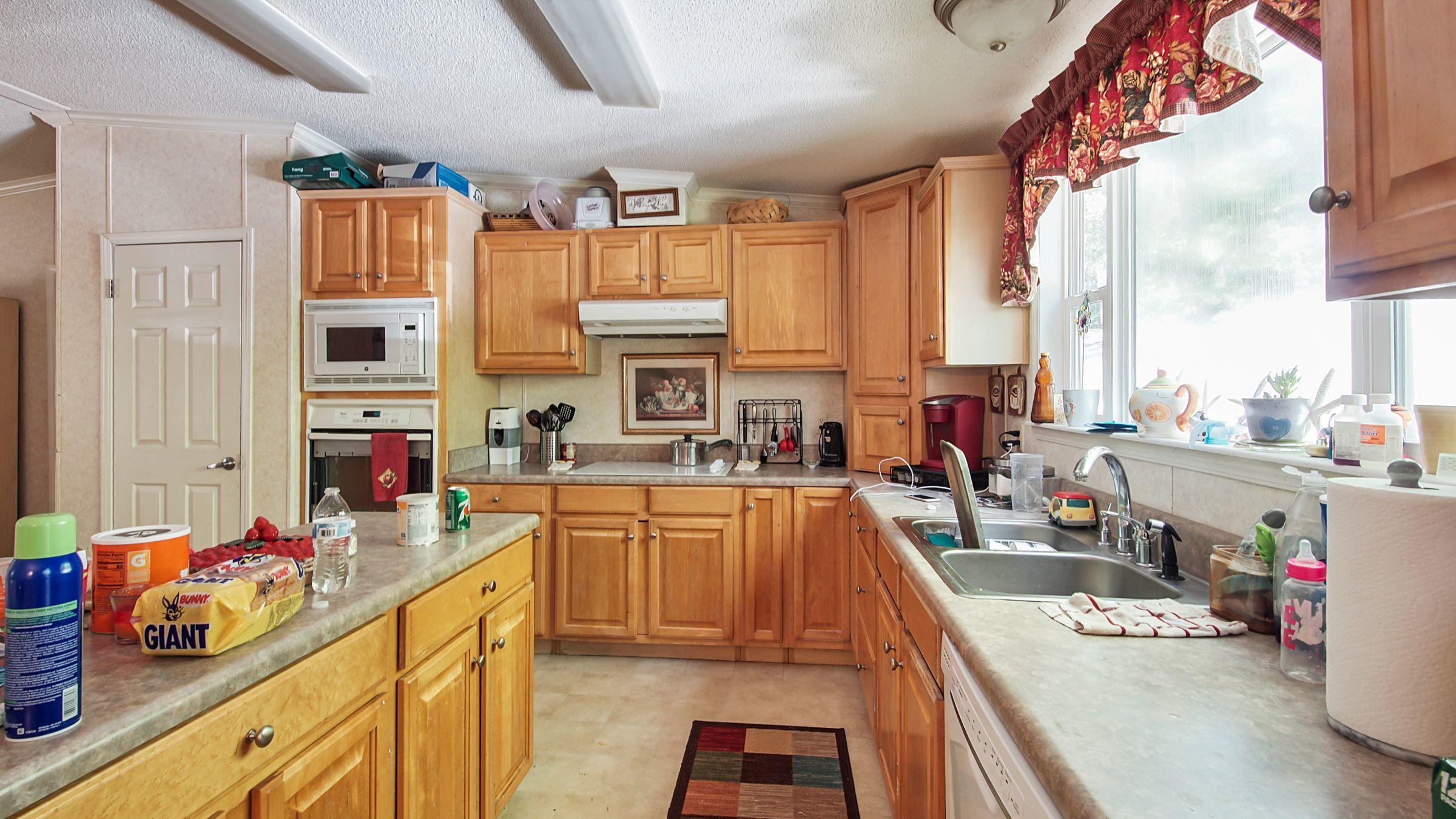 127 Madison Street Freeport, FL 32439 - Photo 4 of 8 a large kitchen with stainless steel appliances lots of counter top space