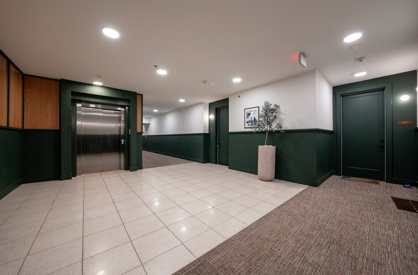 1701 Simond Avenue, Unit 212 Austin, TX 78723 - Photo 17 of 28 Community lobby with wainscoting and recessed lighting
